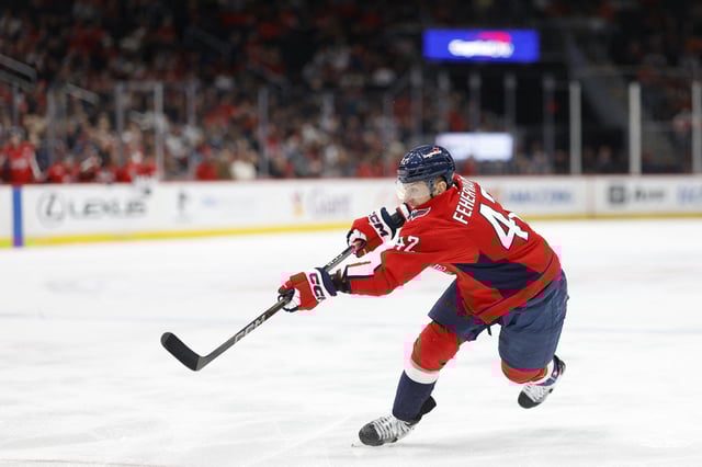 Feb 25, 2025; Washington, District of Columbia, USA; Washington Capitals defenseman Martin Fehervary (42) shoots the puck against the Calgary Flames in the third period at Capital One Arena. Mandatory Credit: Geoff Burke-Imagn Images/File Photo