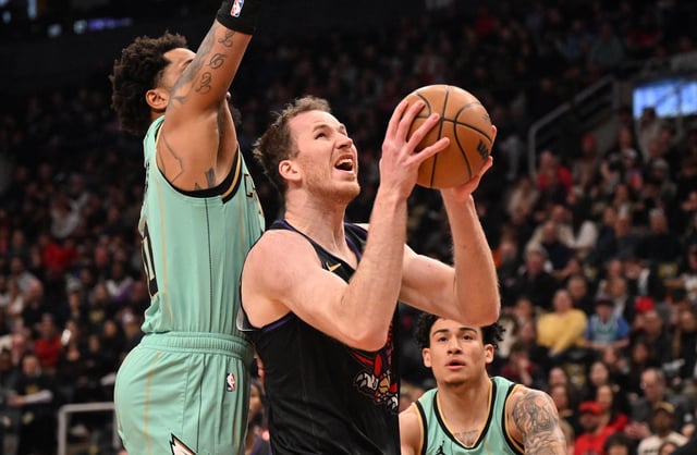 Mar 28, 2025; Toronto, Ontario, CAN;  Toronto Raptors center Jakob Poeltl (19) prepares to shoot the ball against the Charlotte Hornets in the first half at Scotiabank Arena. Mandatory Credit: Dan Hamilton-Imagn Images/File Photo