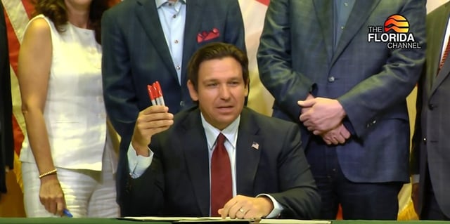 At a budget signing ceremony at The Villages on June 30, 2025, Gov. Ron DeSantis held up three red pens he said he used to veto spending.
