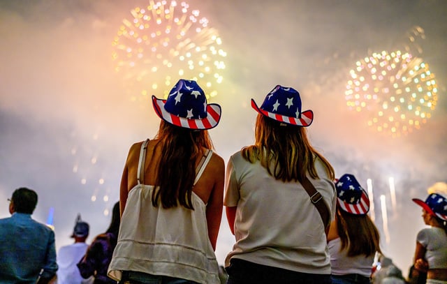 Spectators watch the New York City Macy's fireworks display on July 04, 2024 in Hoboken, NJ.