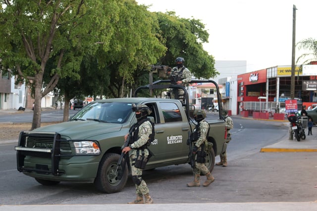 Members of the Mexican Army stand guard in the area where two members of a faction of the Sinaloa Cartel were detained during an operation by Mexican federal authorities, in Culiacan, Mexico, Feb. 19, 2025.
