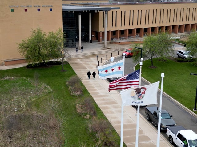People enter and exit Little Village Lawndale High School, April 11, 2024, in Chicago. (Stacey Wescott/Chicago Tribune)