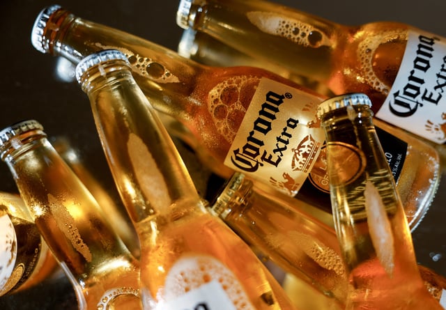 Bottles of Corona beer, the flagship brand of Grupo Modelo are displayed in this illustration taken in Monterrey, Mexico, February 18, 2025. REUTERS/Daniel Becerril/ File Photo