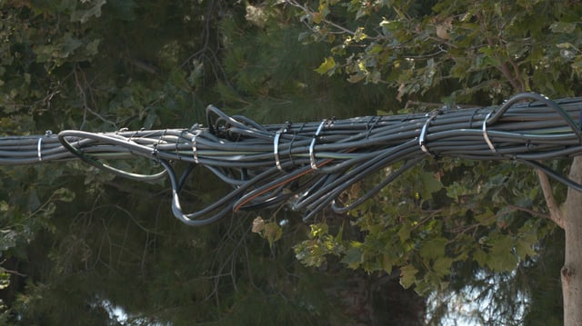 New fiber optic cables could be seen Tuesday in Van Nuys where lines were severed last month.