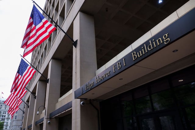 Flags hang outside of the J. Edgar Hoover Federal Bureau of Investigation (FBI) building on June, 2025 in Washington, DC.