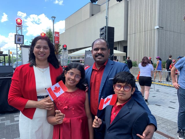  Nidhu Mary, left, her husband and two children at the Dundas Place citizenship ceremony on Canada Day, July 1, 2025. (Adshayah Sathiaseelan/London Free Press)