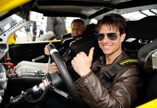 Actor Tom Cruise and father-in-law Martin Joseph Holmes prepare to drive the car that was used in the film &#34;Days of Thunder&#34; prior to the NASCAR Sprint Cup Series Daytona 500 at Daytona International Speedway on February 15, 2009 in Daytona Beach, Florida.