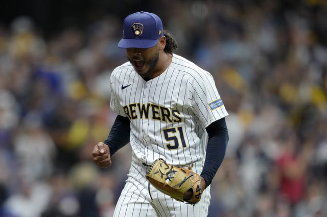 MILWAUKEE, WISCONSIN - OCTOBER 03: Freddy Peralta #51 of the Milwaukee Brewers reacts in the eighth inning against the New York Mets during Game Three of the Wild Card Series at American Family Field on October 03, 2024 in Milwaukee, Wisconsin.
