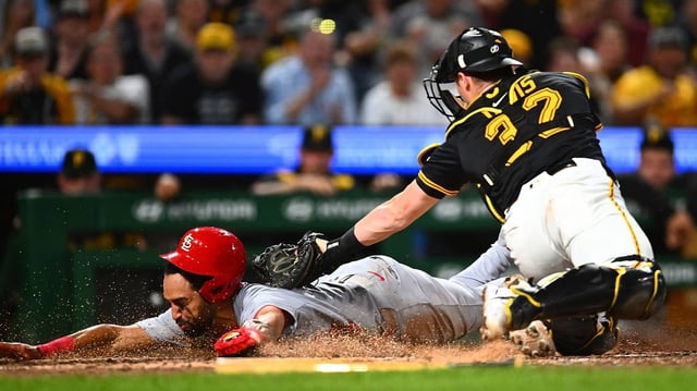 A sliding Jose Fermin of the St. Louis Cardinals is tagged out at home plate by Pittsburgh Pirates catcher Henry Davis (32) during the ninth inning at PNC Park on Tuesday, July 1, 2025, in Pittsburgh. (Joe Sargent/Getty Images/TNS)