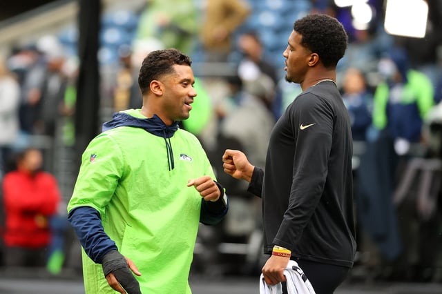 Russell Wilson #3 of the Seattle Seahawks speaks with Jameis Winston #2 of the New Orleans Saints prior to a game at Lumen Field on October 25, 2021 in Seattle, Washington.