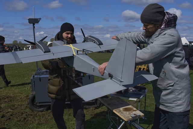 FILE - A manufacturer demonstrates a Ukrainian made drone at a Ukraine Defense Innovations exhibition for military clients on an undisclosed location in Ukraine, Friday, April 11, 2025. (AP Photo/Efrem Lukatsky, File)