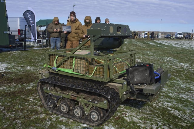 FILE - A manufacturer demonstrates a Ukrainian made unmanned ground vehicle at a Ukraine Defense Innovations exhibition for military clients on an undisclosed location in Ukraine, Friday, April 11, 2025. (AP Photo/Efrem Lukatsky, File)