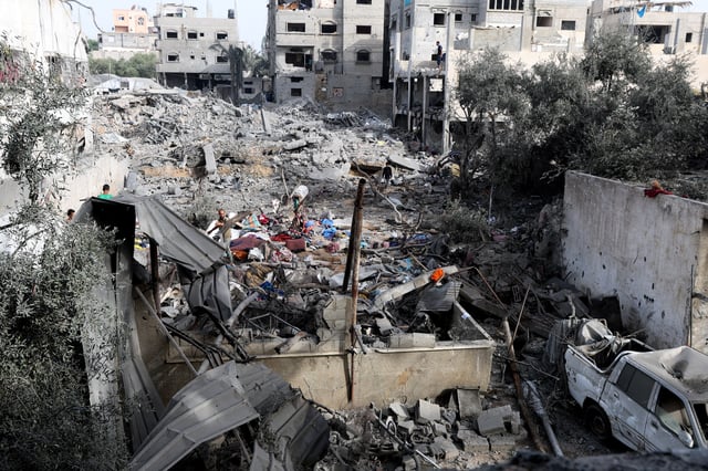 A Palestinian man inspects the site of an Israeli strike on a house that took place on Monday, in Zawayda in the central Gaza Strip, July 1, 2025.REUTERS/Ramadan Abed/File Photo
