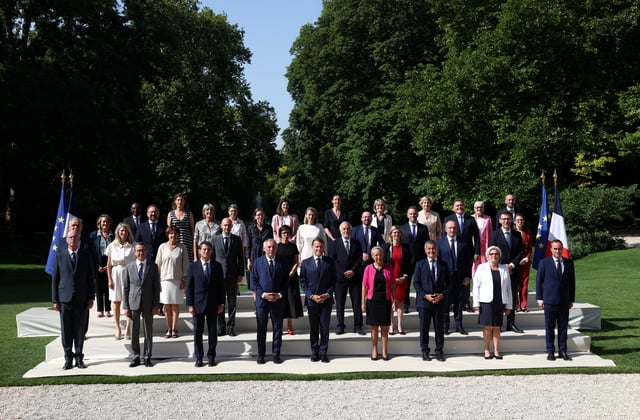 French President Emmanuel Macron, Prime Minister Francois Bayrou and ministers pose for a family photo in the gardens of the Elysee Palace before the weekly cabinet meeting in Paris, France, July 2, 2025. REUTERS/Tom Nicholson