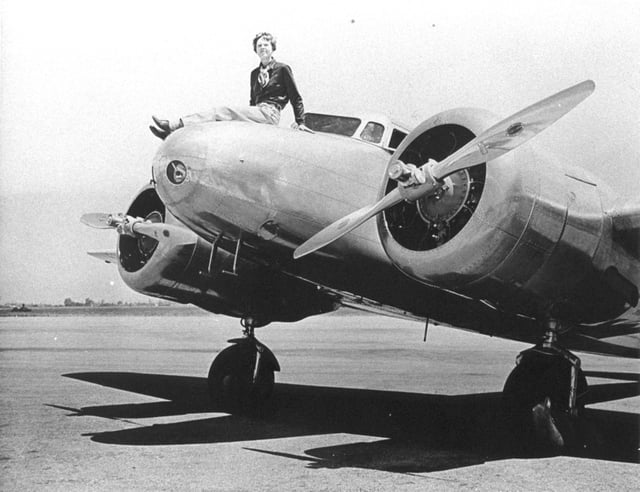 Amelia-Earhart-1.jpg:  
Amelia Earhart on the nose of her Lockheed Electra, March 12, 1937.