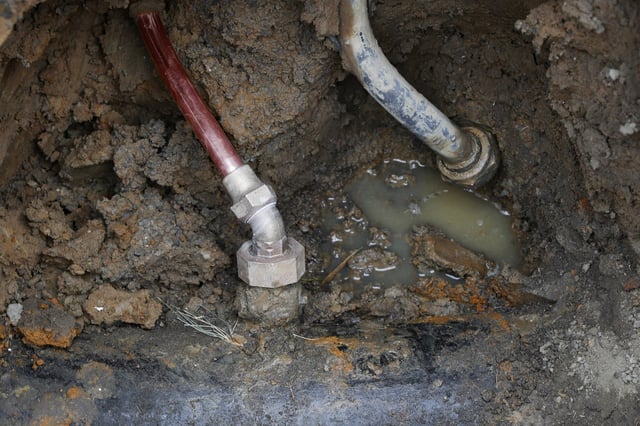A copper water supply line, left, after being installed to replace lead piping in Flint, Mich., in 2018.