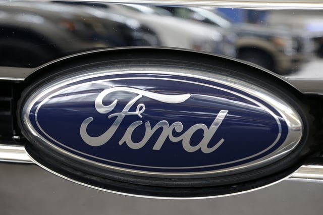 FILE - This Photo taken Feb. 14, 2013 shows a Ford logo at the 2013 Pittsburgh Auto Show in Pittsburgh. (AP Photo/Gene J. Puskar, File)