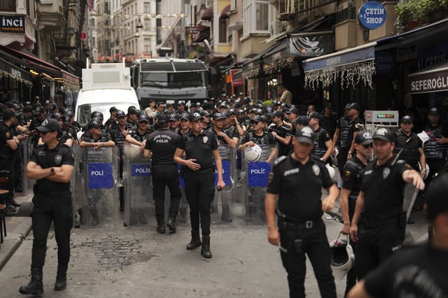 Police officers take position prior to a protest against satirical LeMan magazine after they published a cartoon that allegedly depicted the Prophet Muhammad, in Istanbul, Turkey, Tuesday, July 1, 2025. (AP Photo/Francisco Seco)