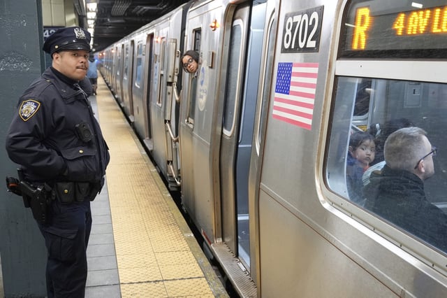 Police officers patrol in a subway station in New York, Thursday, March 20, 2025. This is not the subway station where Hossain was injured.