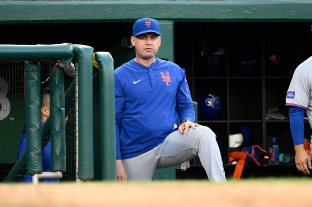 New York Mets manager Carlos Mendoza (64) in action during a baseball game against the Washington Nationals, Saturday, April 26, 2025, in Washington. (AP Photo/Nick Wass)