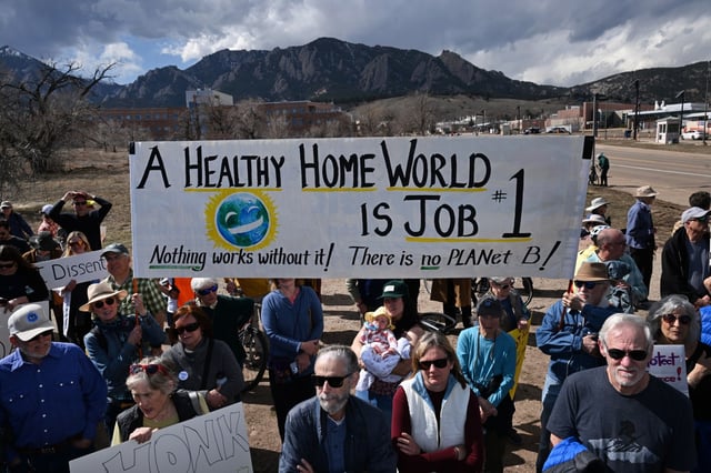 Protesters hold up signs as they join in a large rally and protest outside of the National Oceanic and Atmospheric Association&#39;s offices in Boulder, Colorado, on March 3, 2025. Hundreds gathered at 325 Broadway to protest the firings of federal government employees. The rally was organized by David Skaggs, a former congressman for whom a research center housing NOAA labs is named. (Photo by Helen H. Richardson/The Denver Post)