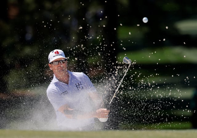 Golf - The Masters - Augusta National Golf Club, Augusta, Georgia, U.S. - April 13, 2025 Zach Johnson of the U.S. plays out from the bunker on the 7th hole during the final round REUTERS/Brian Snyder/File Photo