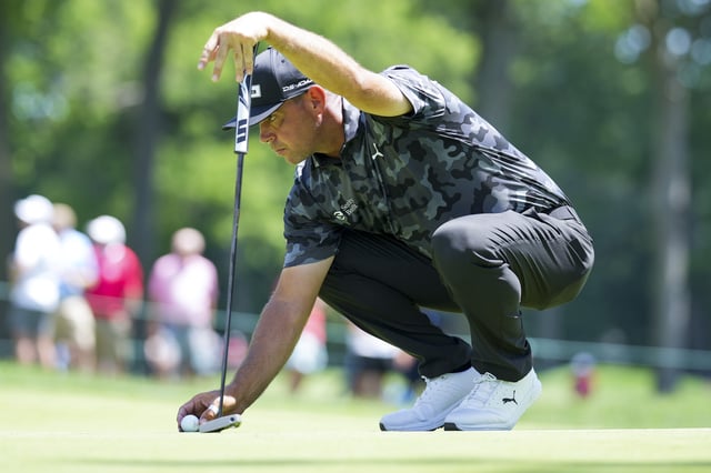 Jun 28, 2025; Detroit, Michigan, USA; Gary Woodland lines up a putt on the fourth green during the third round of the Rocket Mortgage Classic golf tournament. Mandatory Credit: Aaron Doster-Imagn Images/File Photo