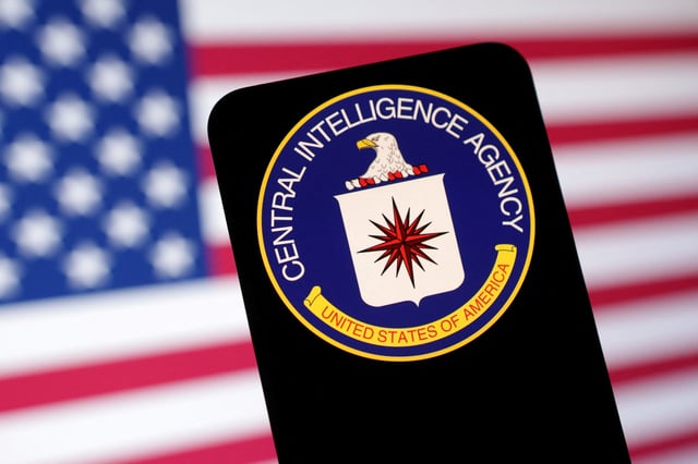 CIA (Central Intelligence Agency) logo and U.S. flag are seen in this illustration taken May 6, 2025. REUTERS/Dado Ruvic/Illustration/File Photo