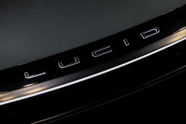 Lucid signage is displayed on a vehicle during the New York International Auto Show Press Preview in New York City, U.S., April 16, 2025. REUTERS/Jeenah Moon/ File Photo