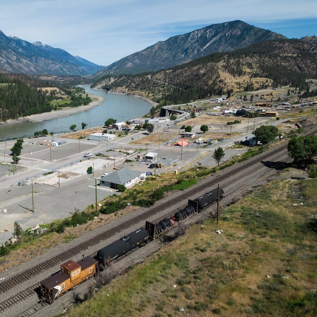 A CPKC firefighting train sits on the tracks above the village of Lytton, B.C., on Tuesday, June 25, 2024. Mayor Denise O'Connor shared an update on the rebuilding progress Tuesday, ahead of the third anniversary of the fire that destroyed 90 per cent of the community. THE CANADIAN PRESS/Darryl Dyck