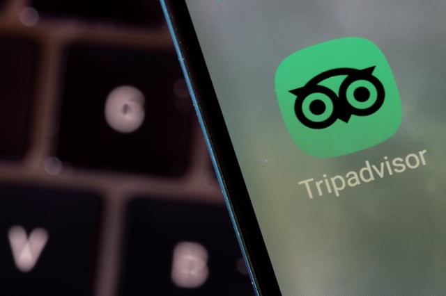 Tripadvisor app is seen on a smartphone in this illustration taken February 27, 2022. REUTERS/Dado Ruvic/Illustration/File Photo