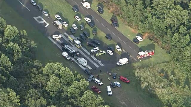 Emergency personal respond to a small plane crash near Cross Keys Airport in Williamstown, New Jersey, on Wednesday, July 2.