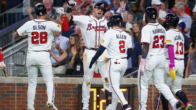 Jul 2, 2025; Atlanta, Georgia, USA; Atlanta Braves first baseman Matt Olson (28) celebrates with third baseman Austin Riley (27)after a grand slam against the Los Angeles Angels in the sixth inning at Truist Park. Mandatory Credit: Brett Davis-Imagn Images
