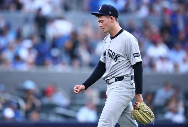 TORONTO, ON - JULY 02:  Will Warren #98 of the New York Yankees leaves the field at the end of the first inning after giving up 7 runs during a game against the Toronto Blue Jays at Rogers Centre on July 02, 2025 in Toronto, Ontario, Canada.  (Photo by Vaughn Ridley/Getty Images)