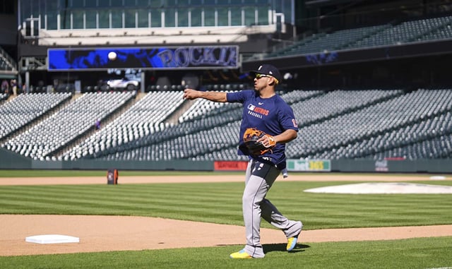 Houston Astros third baseman Isaac Paredes warms up before a baseball game against the Colorado Rockies, Wednesday, July 2, 2025, in Denver. (AP Photo/David Zalubowski)