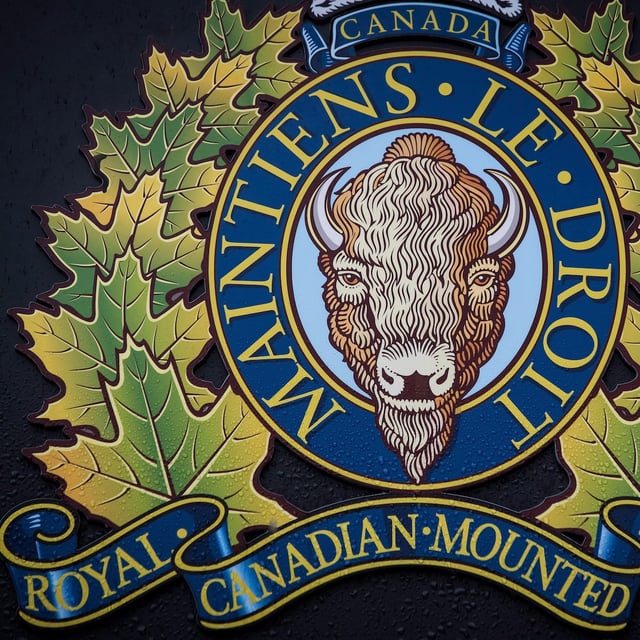 The RCMP logo is seen outside Royal Canadian Mounted Police "E" Division Headquarters, in Surrey, B.C., on Friday April 13, 2018. THE CANADIAN PRESS/Darryl Dyck
