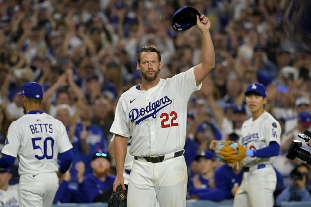 Jul 2, 2025; Los Angeles, California, USA;  Los Angeles Dodgers starting pitcher Clayton Kershaw (22) acknowledges the crowd after striking out Chicago White Sox third baseman Vinny Capra (41) for his 3000th career strike at Dodger Stadium. Mandatory Credit: Jayne Kamin-Oncea-Imagn Images
