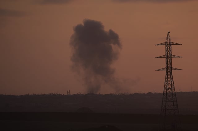 Smoke from an Israeli bombardment rises over the Gaza Strip, seen from southern Israel, Wednesday, July 2, 2025. (AP Photo/Ohad Zwigenberg)