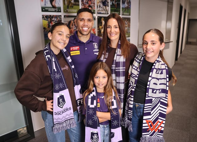 Michael Walters with wife Marnie and children Laila 13, Mackenzie 7 and Addison 11 at Thursday’s retirement press conference.
