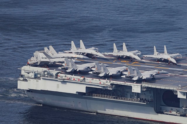 The People's Liberation Army Navy aircraft carrier Shandong, China's first domestically built aircraft carrier, carries fighter aircraft while sailing into Hong Kong for a five-day visit, in Hong Kong, China, July 3, 2025. REUTERS/Lam Yik