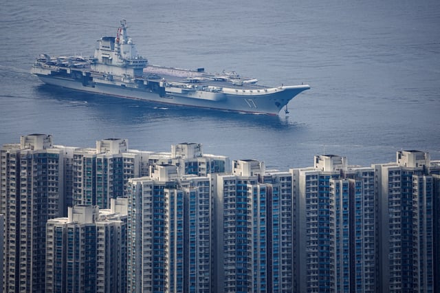 The People's Liberation Army Navy aircraft carrier Shandong, China's first domestically built aircraft carrier, sails into Hong Kong for a five-day visit, in Hong Kong, China, July 3, 2025. REUTERS/Lam Yik