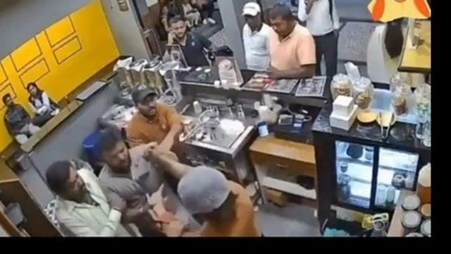Screengrab of a viral video where four men in Bengaluru was seen assaulting a coffee shop worker