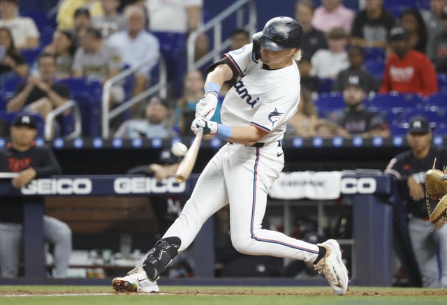 Jul 2, 2025; Miami, Florida, USA;  Miami Marlins left fielder Kyle Stowers (28) hits a home run against the Minnesota Twins during the second inning at loanDepot Park. Mandatory Credit: Rhona Wise-Imagn Images