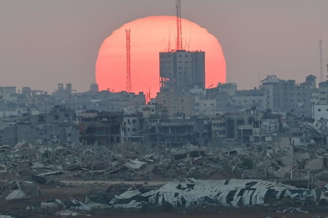 The sun sets over Gaza, as seen from Israel, July 1, 2025. REUTERS/Amir Cohen     TPX IMAGES OF THE DAY