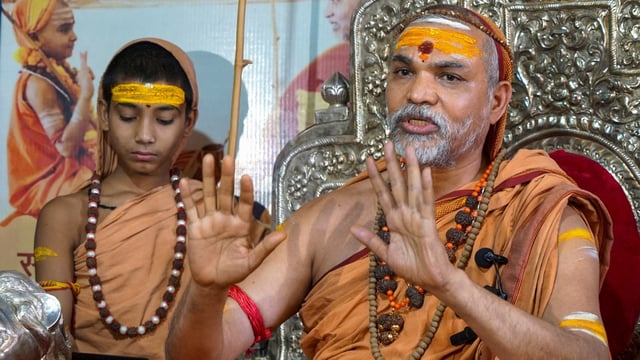 Shankaracharya Avimukteshwarananda adresses a press conference, in Varanasi.
