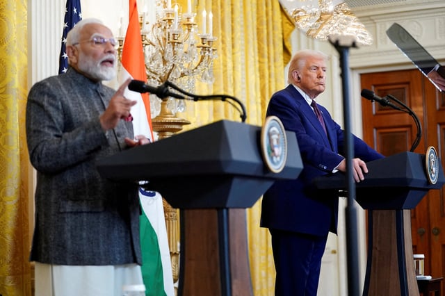 U.S. President Donald Trump listens as Indian Prime Minister Narendra Modi speaks during a joint press conference at the White House in Washington, D.C., U.S., February 13, 2025. REUTERS/Nathan Howard/File Photo