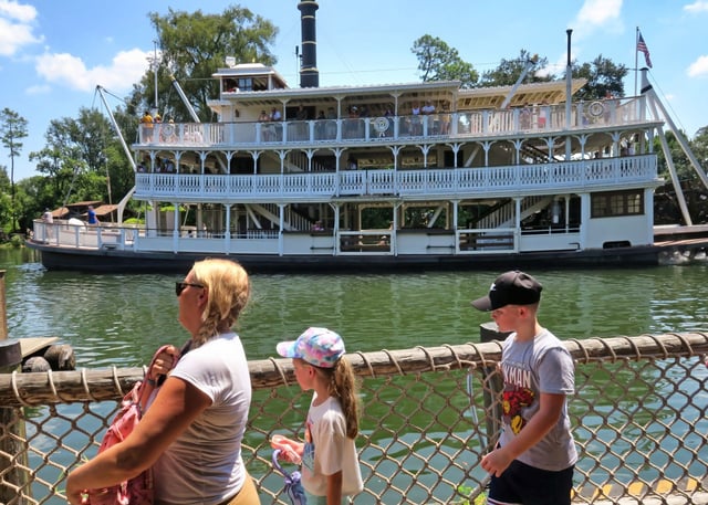 The steam-powered riverboat Liberty Belle on the Rivers of America passing Tom Sawyer Island at the Magic Kingdom in Walt Disney World, Thursday, August 15, 2024. Disney has announced that the island and surrounding river —including the Liberty Belle— will be replaced with two new rides based on the “Cars” movie franchise. (Joe Burbank/Orlando Sentinel)