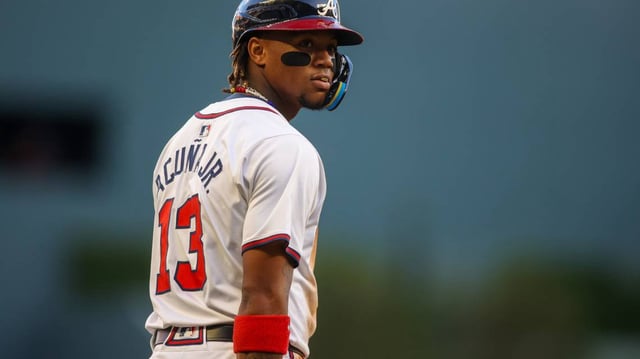 Apr 22, 2024; Atlanta, Georgia, USA; Atlanta Braves right fielder Ronald Acuna Jr. (13) at third base against the Miami Marlins in the first inning at Truist Park.