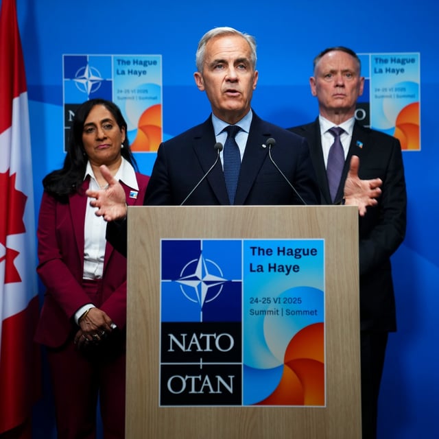 Prime Minister Mark Carney holds a closing press conference with Minister of Foreign Affairs Anita Anand, left and Minister of National Defence David McGuinty following the NATO Summit in The Hague, Netherlands on Wednesday, June 25, 2025. THE CANADIAN PRESS/Sean Kilpatrick