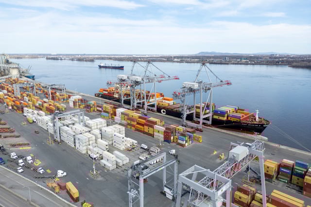 A drone view shows shipping containers and transport trucks at the Port of Montreal in Montreal, Quebec, Canada April 14, 2025. REUTERS/Carlos Osorio/File Photo